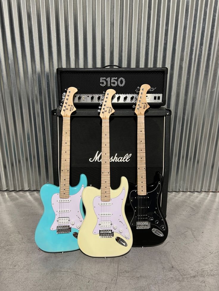 3 might be famous electric guitars in blue, white, black